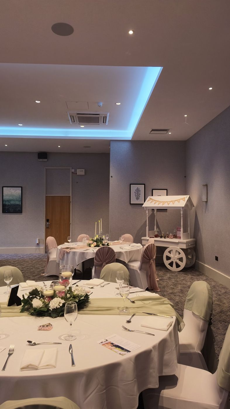 Reception room with sage and blush table styling